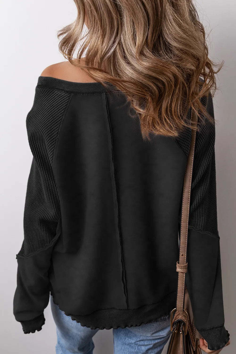 Exposed Seam Long Sleeve Sweatshirt.