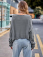 Round Neck Cable-Knit Sweater.