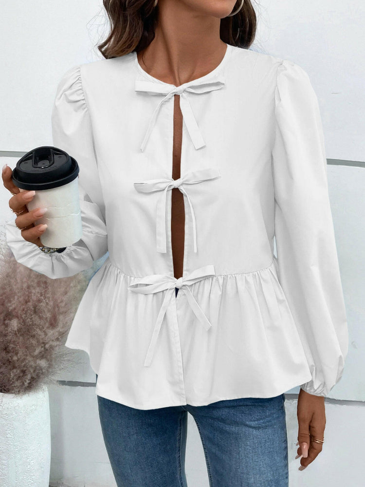 Ivy Lane Peplum Tied Long Sleeve Blouse.