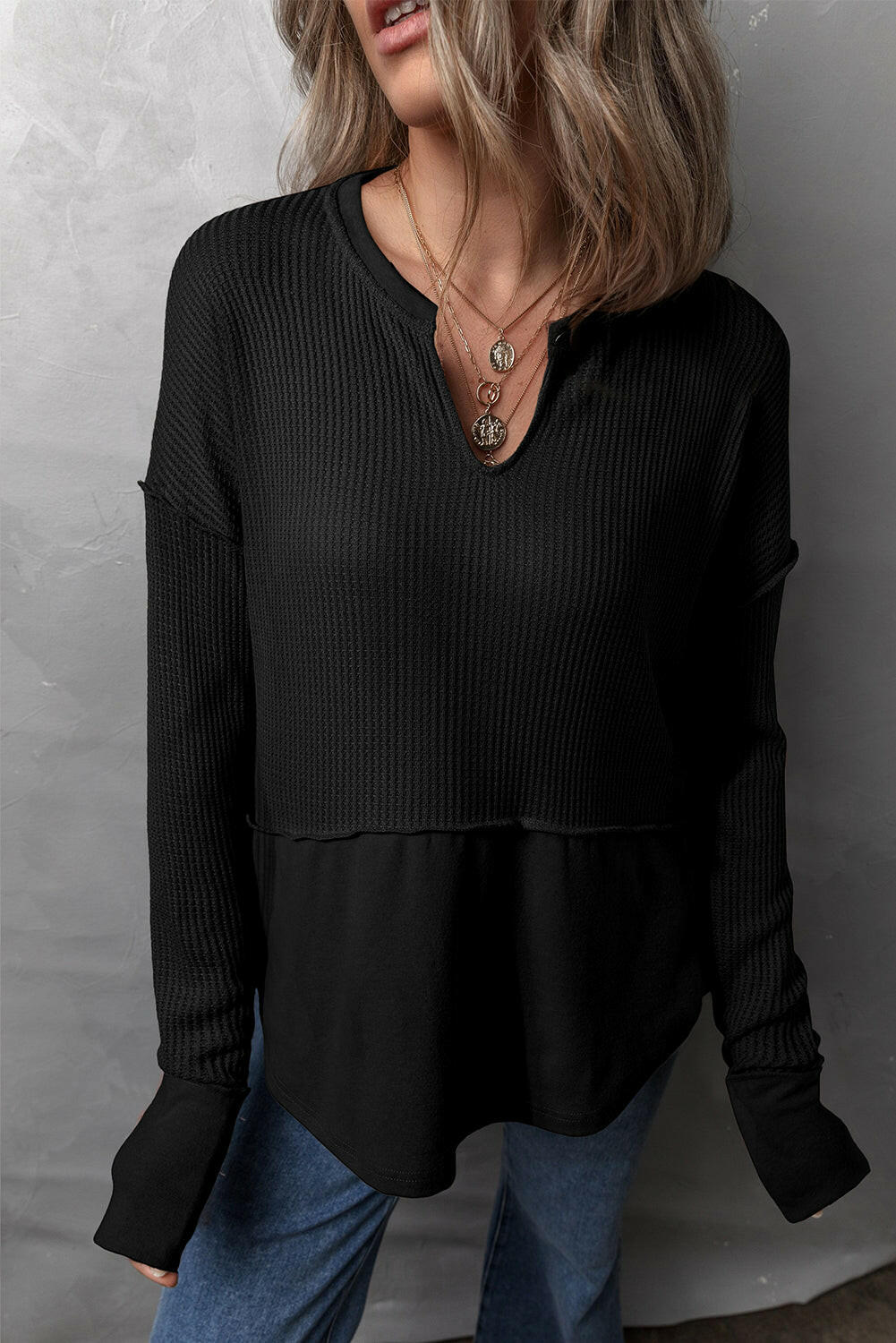 Waffle-Knit Exposed Seam Notched Long Sleeve Top.