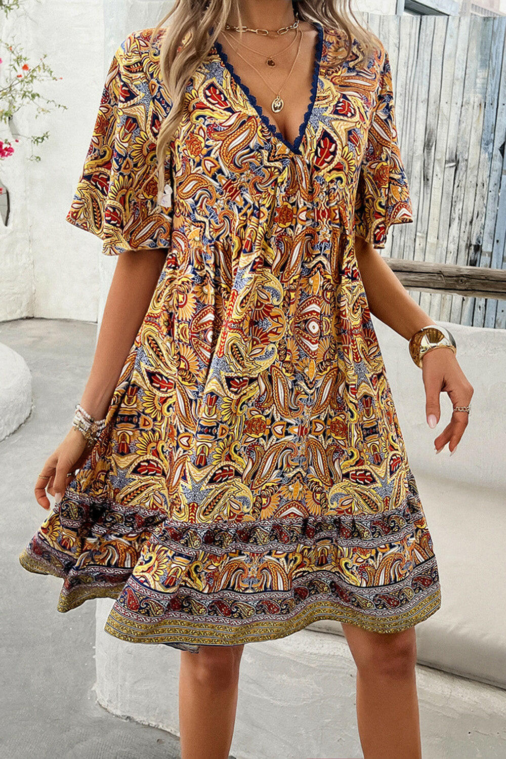 Devine Printed V-Neck Half Sleeve Mini Dress.