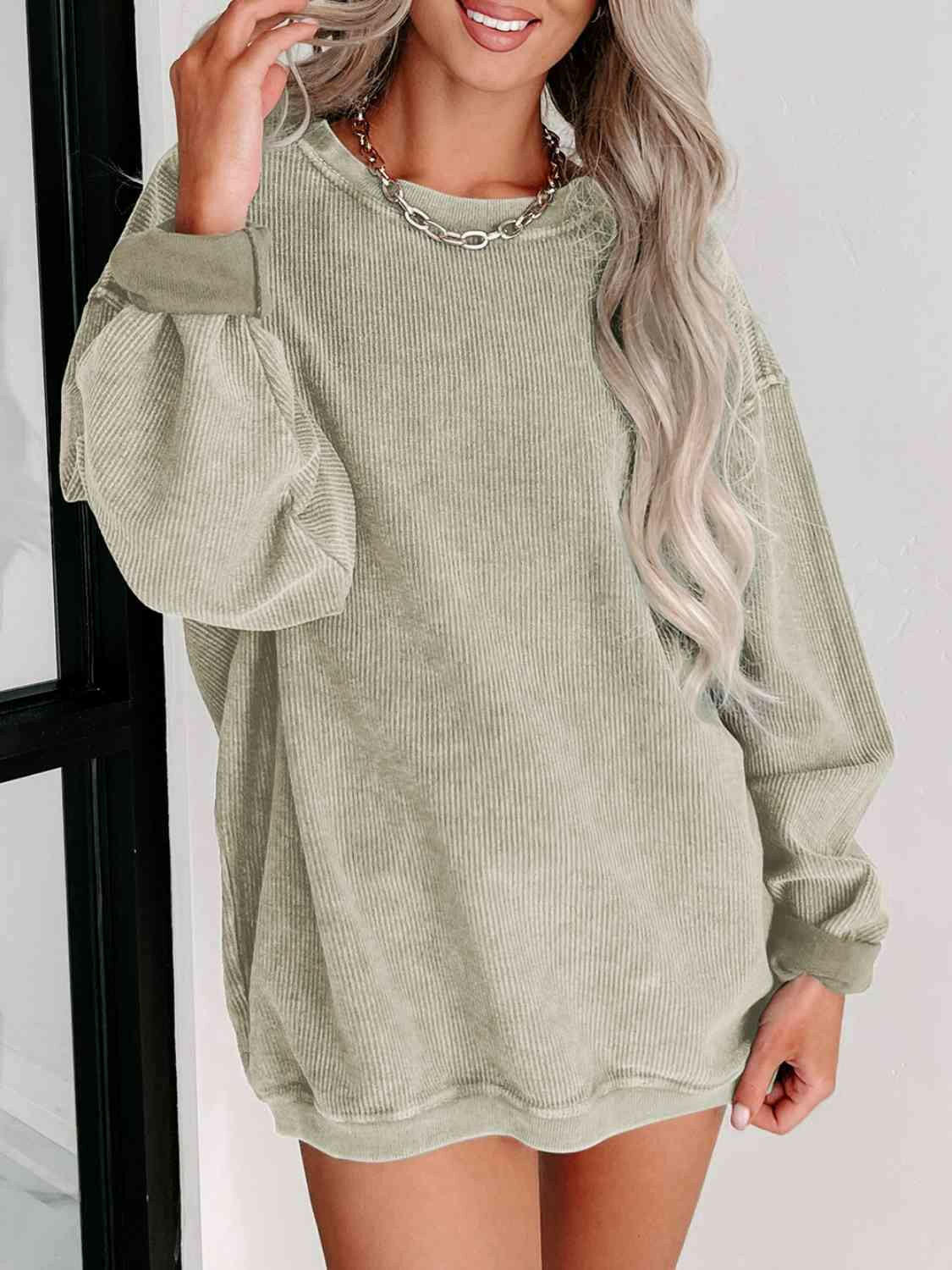 Round Neck Dropped Shoulder Sweatshirt.