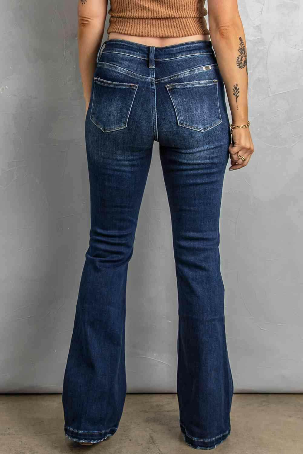 Button Fly Distressed Bootcut Jeans.