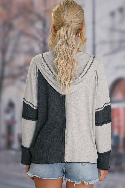 Exposed Seam Color Block Hoodie with Drawstring.