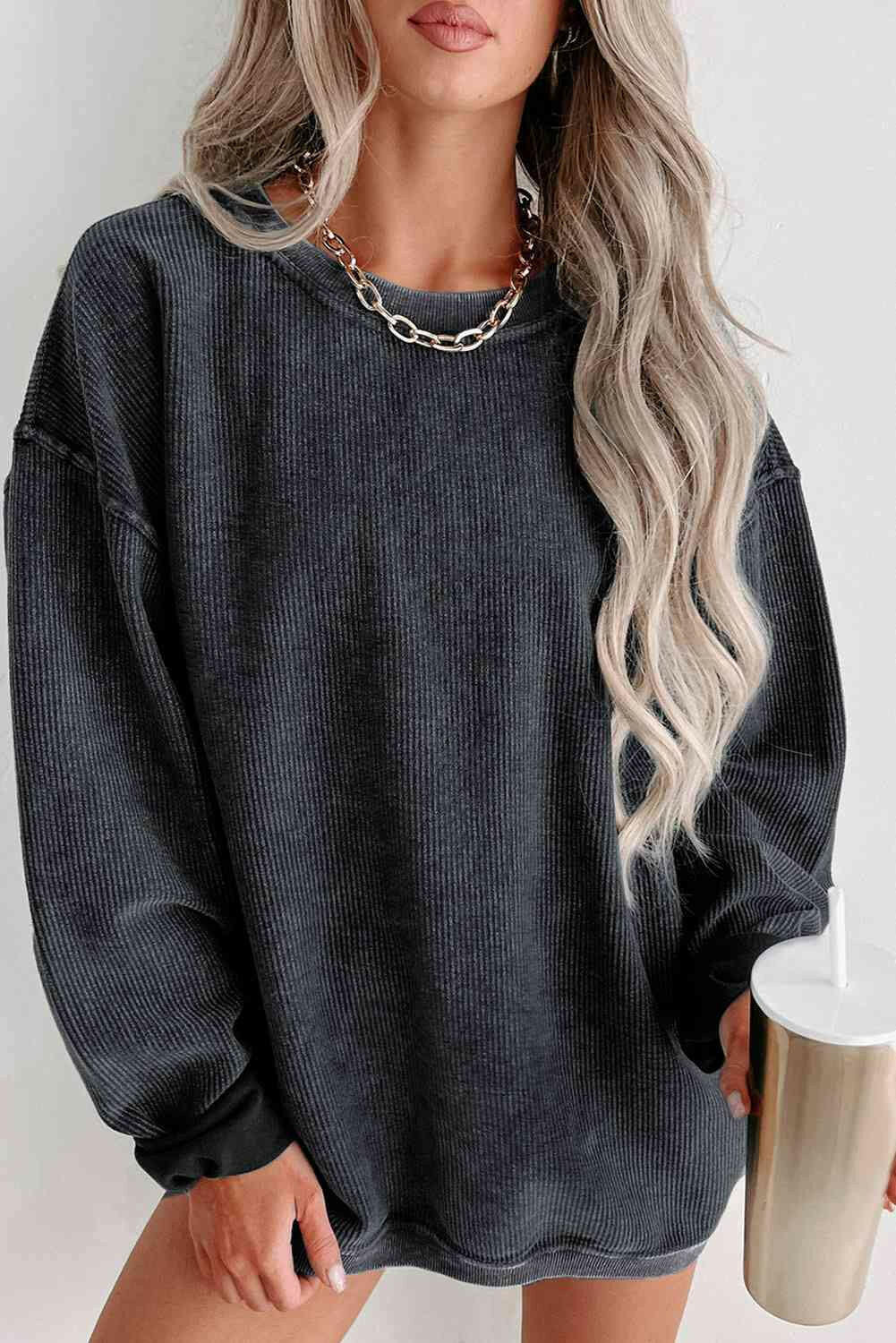 Round Neck Dropped Shoulder Sweatshirt.