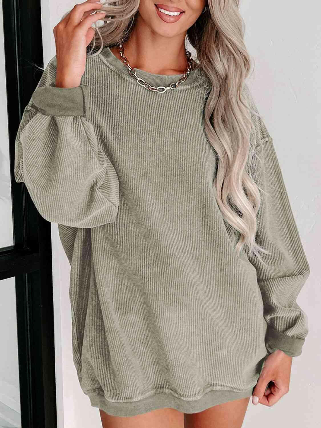 Round Neck Dropped Shoulder Sweatshirt.